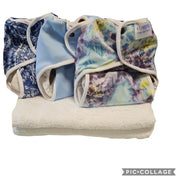 Essential Wrap Terries offer from nature babies 3 essential wraps and three terry nappies and a vest extender